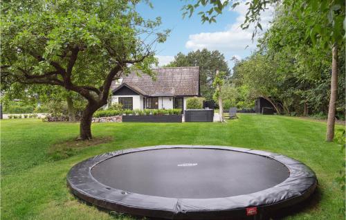 a trampoline in the yard of a house at Lovely Home In Nykøbing Sj With Kitchen in Nykøbing Sjælland