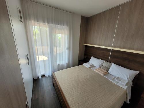 Postel nebo postele na pokoji v ubytování Apartments Branko Medjugorje