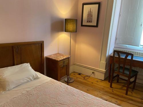 Ένα ή περισσότερα κρεβάτια σε δωμάτιο στο União - Guest House