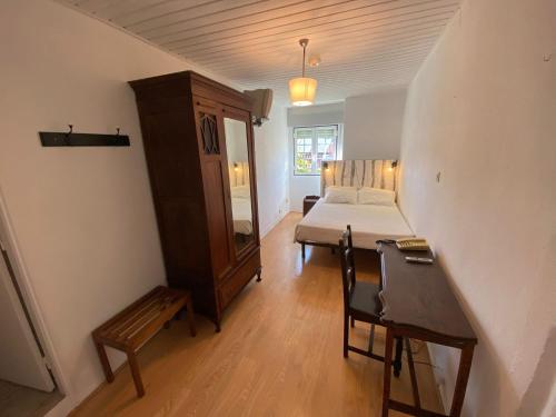 Ένα ή περισσότερα κρεβάτια σε δωμάτιο στο União - Guest House
