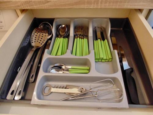 a drawer filled with utensils in a kitchen at Apartman Rijeka Crnojevica in Rijeka Crnojevića
