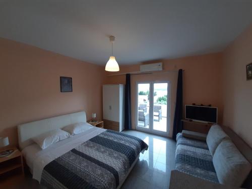Ένα ή περισσότερα κρεβάτια σε δωμάτιο στο Apartments Vuk