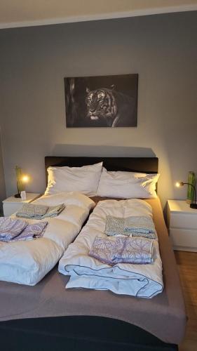 a large bed with two pillows on top of it at Flensburg Süd in Flensburg