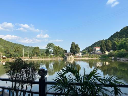 a view of a river from a balcony at Ba Shu Inn in Matola