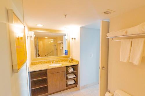 a bathroom with a sink and a mirror at Intracoastal Waterview - Central- Fort Lauderdale - Steps to Beach in Fort Lauderdale