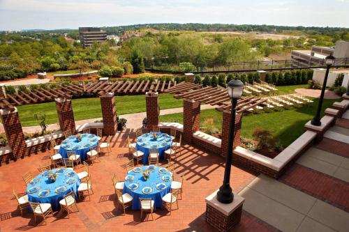 an overhead view of a patio with blue tables and chairs at Marriott Boston Quincy in Quincy