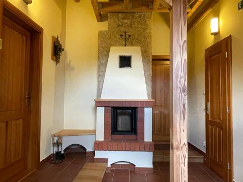 a small fireplace in a room with yellow walls at Ubytovanie u Janusa in Levoča