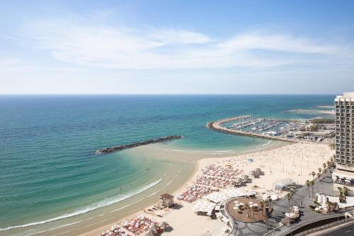 an aerial view of a beach and the ocean at Sheraton Grand Tel Aviv in Tel Aviv