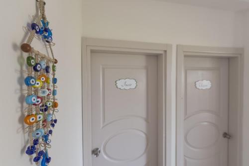 two doors with hello kitty stickers on them at Cilek Butik Hotel in Cesme