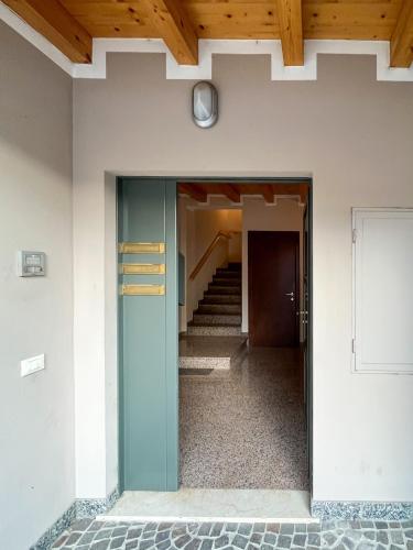 a hallway of a building with a stair case at Casa Vacanze al Lago P2 in Monasterolo del Castello