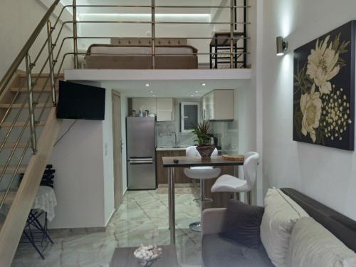a kitchen and a living room with a loft at M&S Corfu Centre Apartment in Agios Rokkos