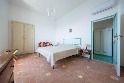 Letto o letti in una camera di Villa Cavalluccio Marino