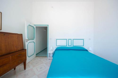 Letto o letti in una camera di Villa Cavalluccio Marino