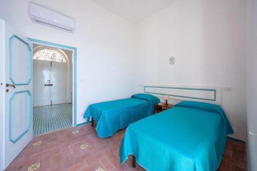 Letto o letti in una camera di Villa Cavalluccio Marino