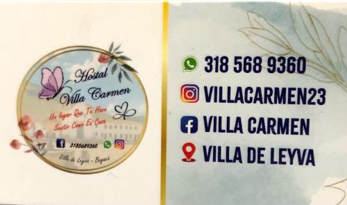 a sign for a restaurant with a picture of a butterfly at Hostal Villa Carmen in Villa de Leyva