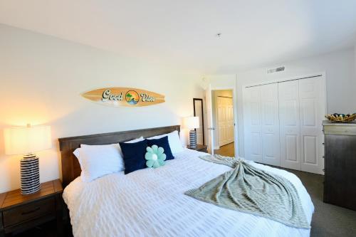 a bedroom with a large bed with blue pillows at Royal Villa - Ocean View - Heated Pools - SEASCAPE'S BEST 1 BEDROOM - 3 BEDS - End Unit in Aptos