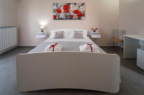 Villa Falcone tesisinde bir odada yatak veya yataklar