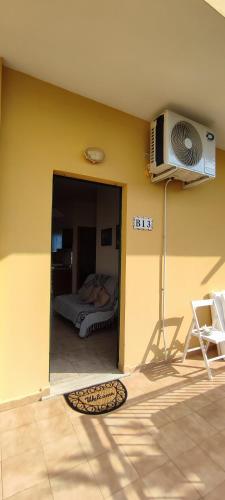 a room with a door open to a bedroom at Ferienwohnung mit Meerblick im Juwel Le Castella in Le Castella