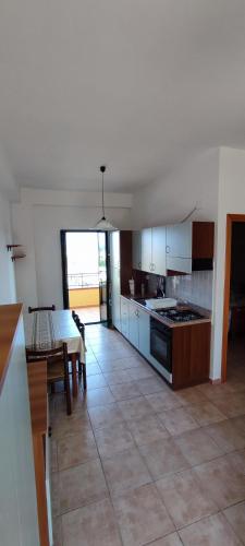 a kitchen with a table and a dining room at Ferienwohnung mit Meerblick im Juwel Le Castella in Le Castella