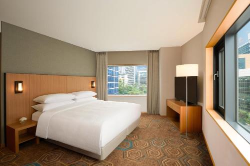 a hotel room with a bed and a window at Four Points by Sheraton Seoul, Guro in Seoul