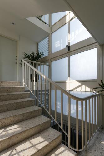 a staircase in a house with glass windows at Apartamentos West End in Guadalajara