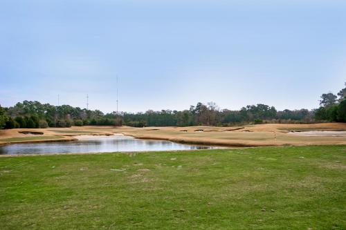 a view of a golf course with a pond at Pinehurst Condos, Unit 6-J in Pawleys Island