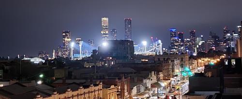 a view of a city at night with at Penthouse 3 bedroom 6 guests 2 bathrooms in Melbourne