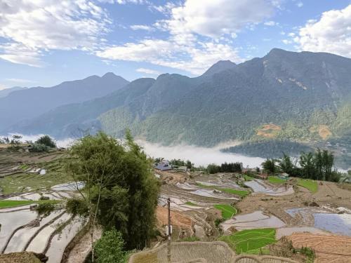 a view of a valley with mountains in the background at Hmong Eco Villas in Sa Pa