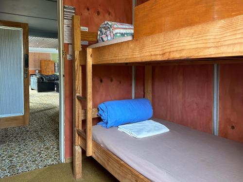 a couple of bunk beds in a room at The Crossing Lodge & Backpackers in National Park