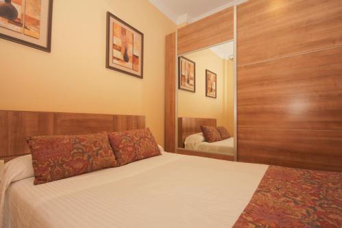 Ένα ή περισσότερα κρεβάτια σε δωμάτιο στο Hostal Costa Azul