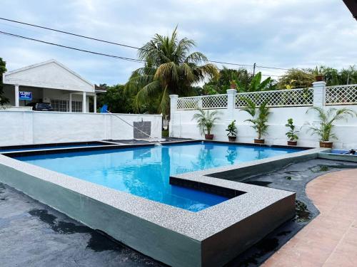 a swimming pool in the backyard of a house at MY VILLA PD in Port Dickson