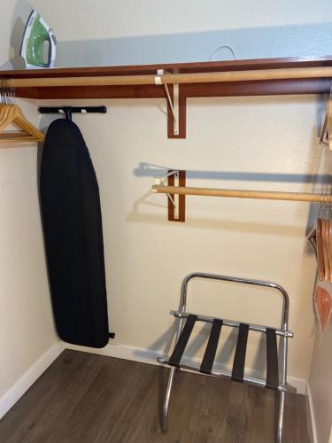 a chair is sitting in a room with a shelf at Toppenish Inn and Suites in Toppenish