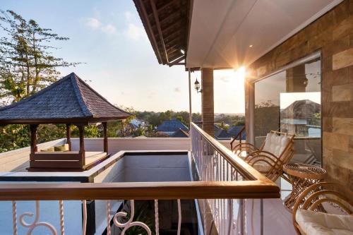 a balcony with a hot tub and a gazebo at Hills House Villa by Globalstay - Jimbaran x Balangan x GWK in Jimbaran