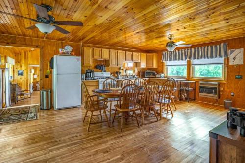 a kitchen and dining room with a table and chairs at Fish~N~Moor Cabin in Hammond