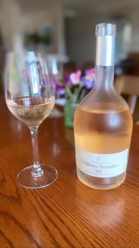 a bottle of wine and a glass on a table at The Gordon Arms Restaurant with Rooms in Yarrow
