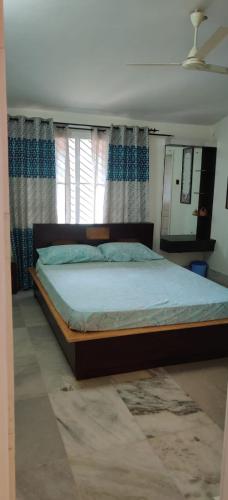 Ένα ή περισσότερα κρεβάτια σε δωμάτιο στο Nature Inn stay