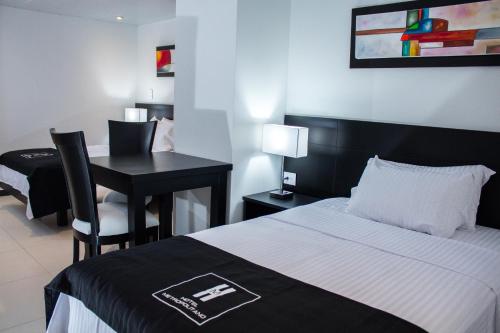 Postel nebo postele na pokoji v ubytování Hotel Metropolitano