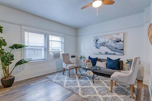 a living room with a couch and a table at Metro Paris - 3 Day Minimum - Secluded Studio near the Long Beach Harbor in Long Beach