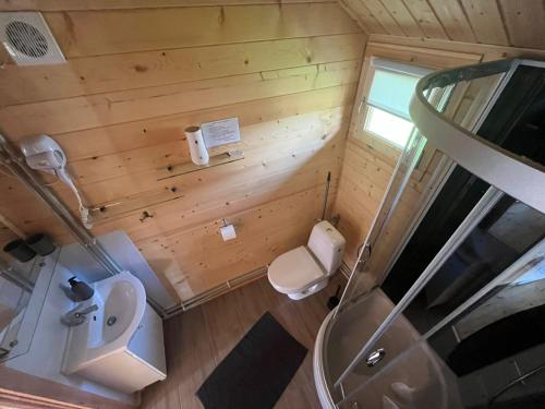 an overhead view of a bathroom with a toilet and a sink at Relax domki Zator in Zator