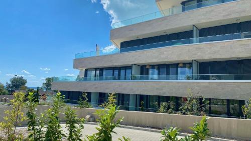 an office building with a lot of windows at Eastlake Apartman in Alsóörs