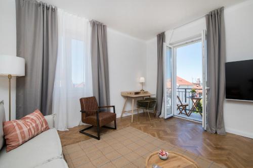 a living room with a couch and a table at Luxury Apartments Bella - Split Centre w Free Parking in Split