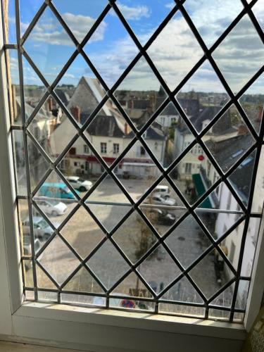 a window with a view of a city at Fleur de Coton 6 pers à 20 minutes de Beauval in Montrichard