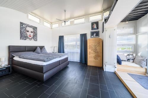 a bedroom with a bed and a window at City Dream Seeblick free parking in Kreuzlingen