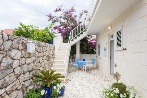 a house with a staircase and a stone wall at Villa AMICA in Zaton