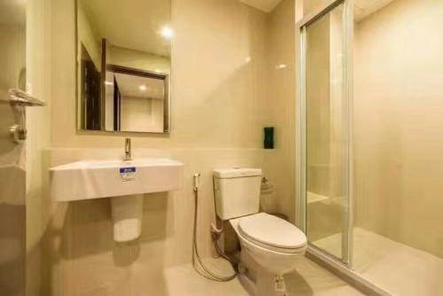 a bathroom with a toilet and a sink and a shower at THE BASE CENTRAL PATTAYA in Pattaya Central
