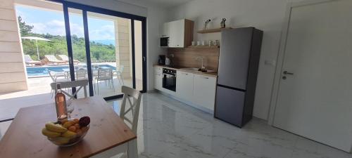 Dapur atau dapur kecil di Apartmani Mariosa