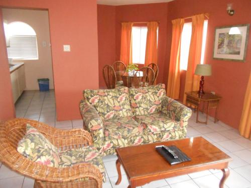 a living room with a couch and a coffee table at Pipers Cove Resort in Runaway Bay