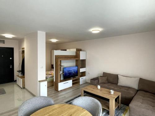 a living room with a couch and a table at Katerina Apartments in Velingrad