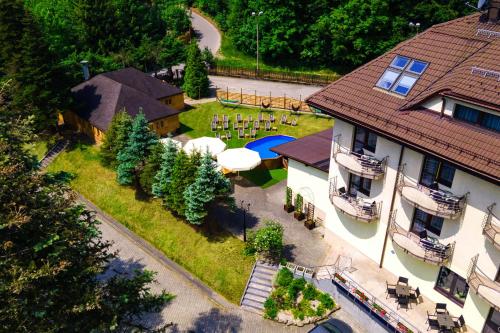 an aerial view of a house with a yard at Hotel Vestina in Wisła