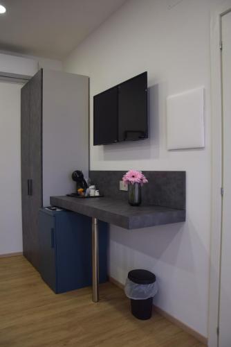 TV o dispositivi per l'intrattenimento presso Rosa Rooms Pompei